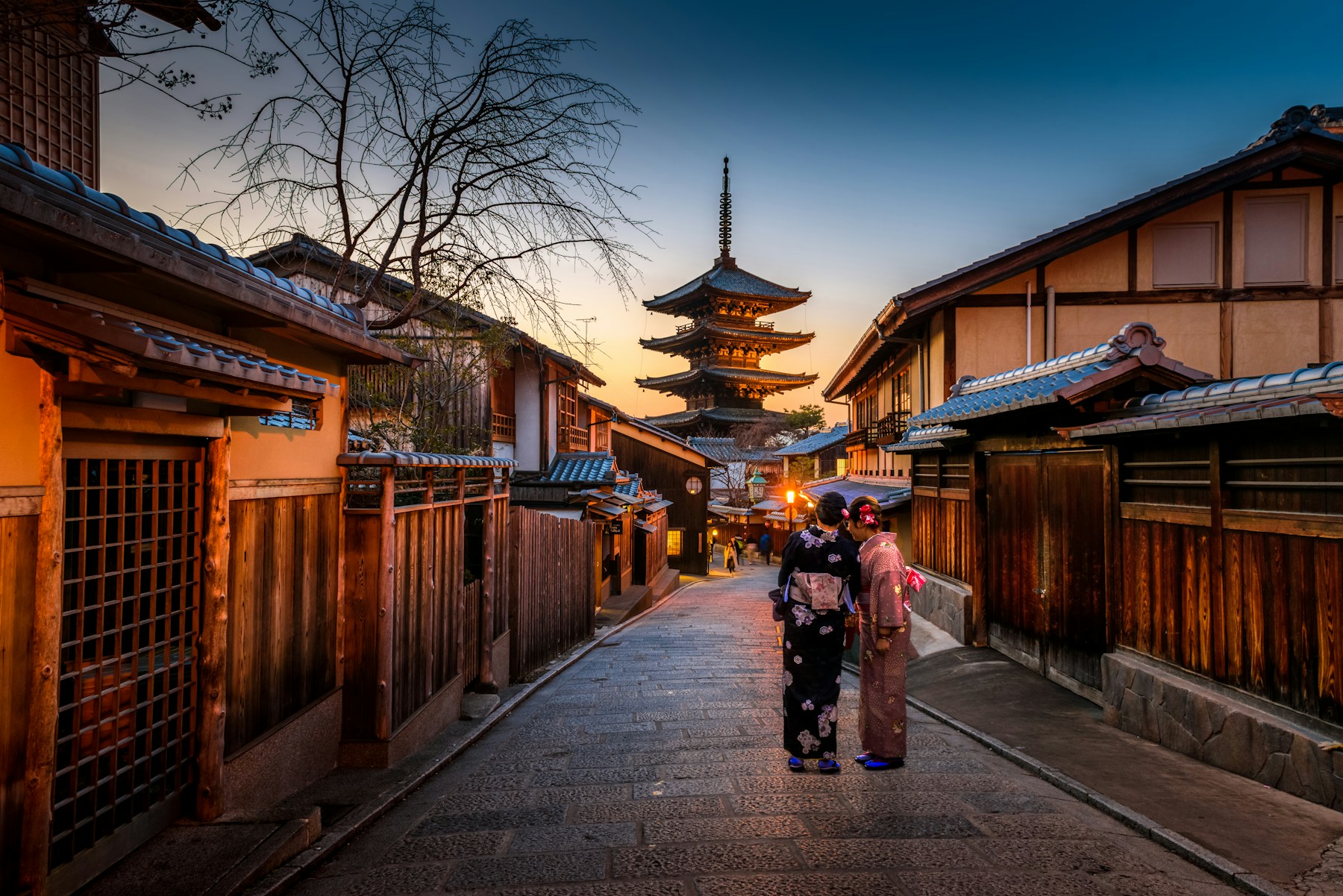 Traditional Japanese street with a pagoda framed by wooden buildings